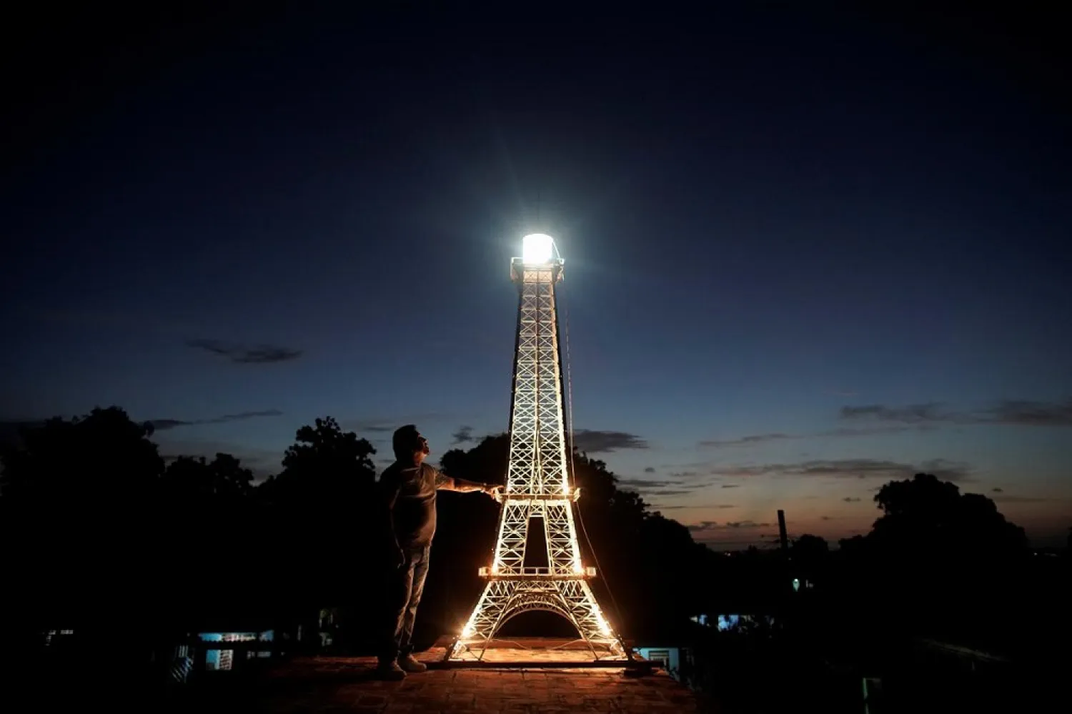 The illuminated four-meter high Eiffel Tower replica by Cuban blacksmith Jorge Enrique Salgado. (Reuters)