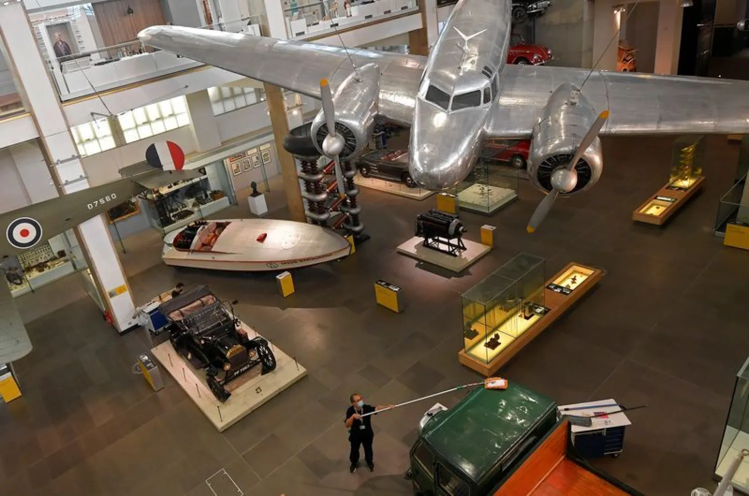 Employees clean exhibits ahead of the reopening of the Science Museum, in London, Britain | REUTERS