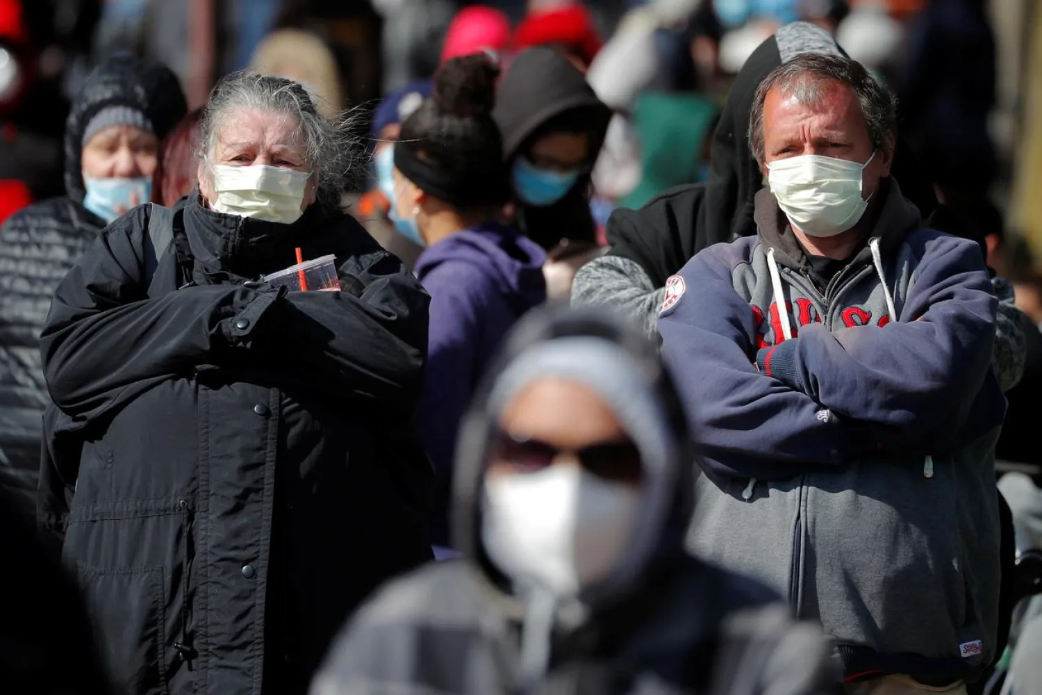 People wait in a line around the block for a pop-up food pantry amid the coronavirus disease (COVID-19) outbreak in Chelsea, Massachusetts, U.S., April 17, 2020. REUTERS/Brian Snyder
