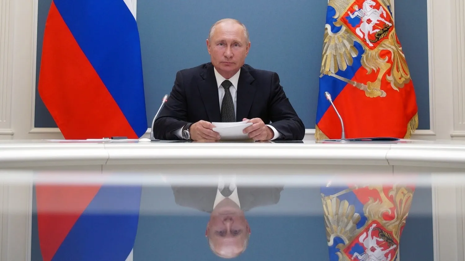 Russian President Putin takes part in a video conference call, dedicated to the opening of new military medical centers for patients infected with the coronavirus, in Moscow, Russia June 30. (Reuters)