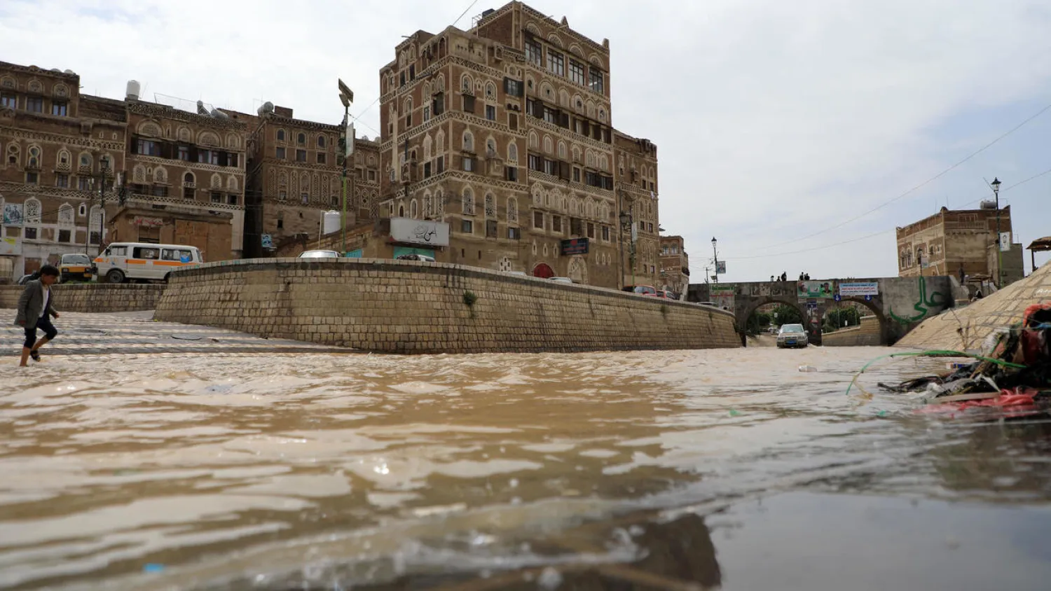 Floodwaters flow past UNESCO-listed buildings in the old city of Yemen's rebel-held capital Sanaa | AFP