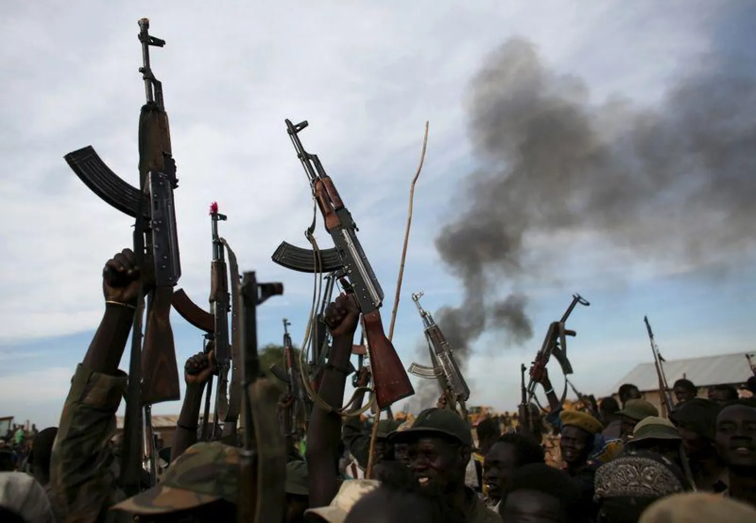 Rebel fighters hold up their rifles as they walk, Upper Nile State, South Sudan. File. REUTERS/Goran Tomasevic/File Photo