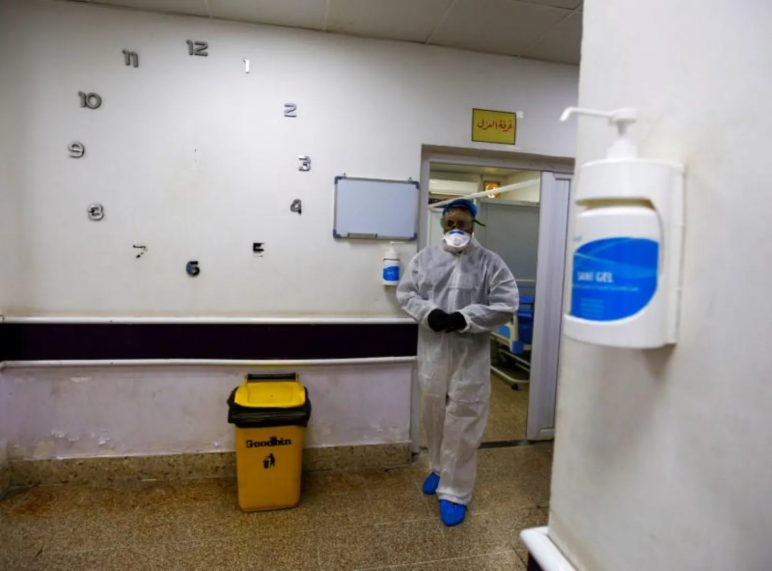 A member of the medical team walks near quarantine room of a hospital, following the outbreak of the new coronavirus, in Najaf, Iraq (Reuters)