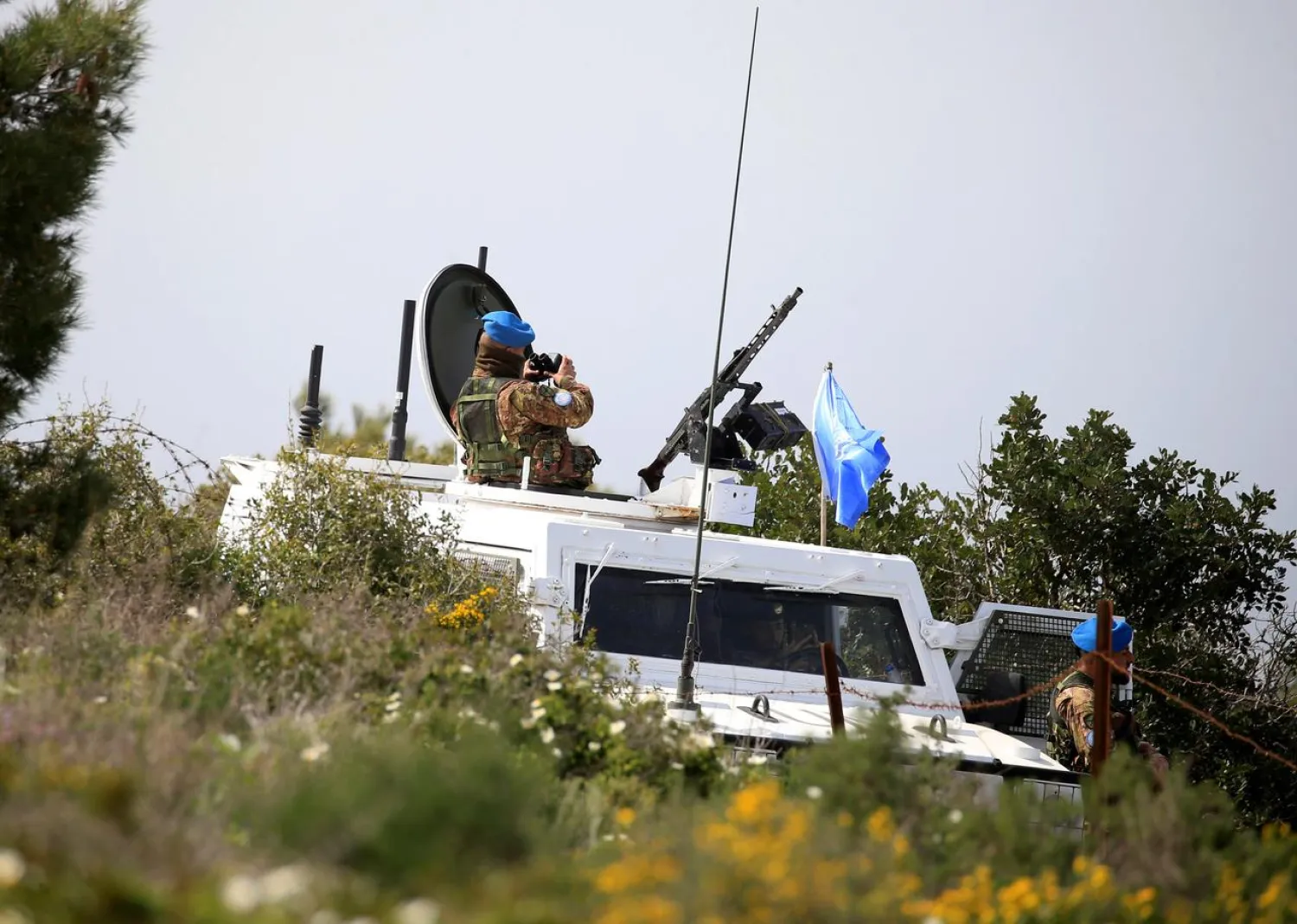 United Nations Interim Force in Lebanon (UNIFIL) peacekeepers watch as Israeli workers build a wall near the border with Israel, near the village of Naqoura, Lebanon March 6, 2018. REUTERS/Ali Hashisho