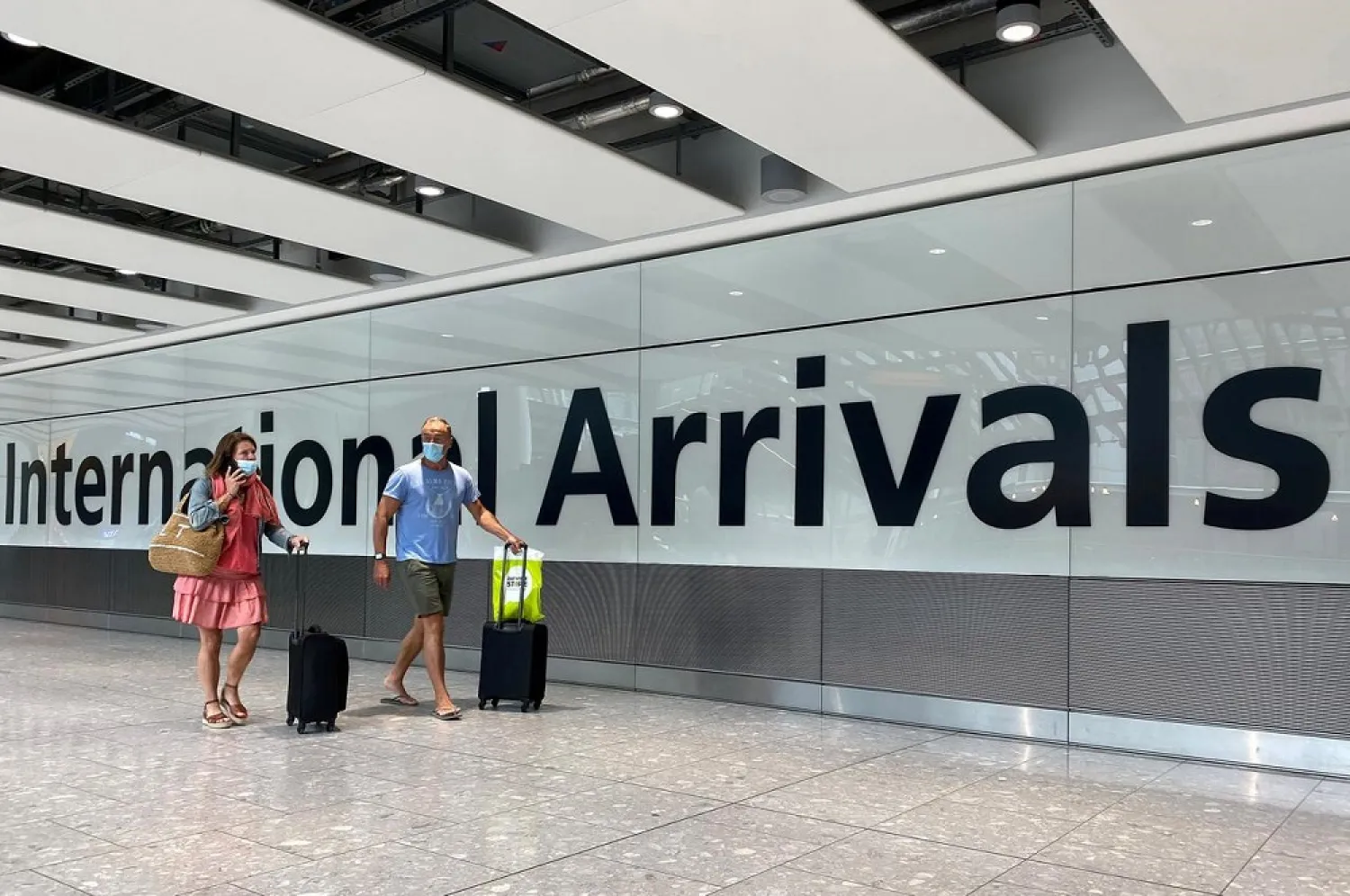 Passengers from international flights arrive at Heathrow Airport, following the outbreak of the coronavirus disease (COVID-19), London, Britain, July 29, 2020. (Reuters)