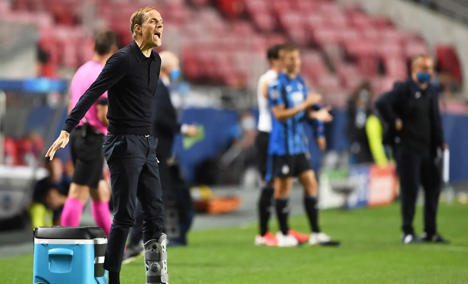 PSG coach Thomas Tuchel, who injured his ankle last week, during their Champions League match against Atalanta. (AFP)