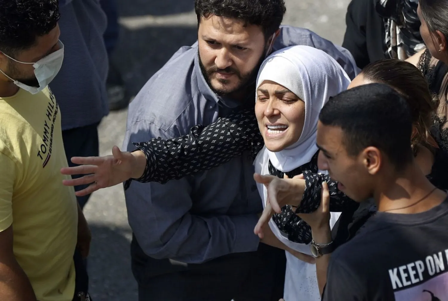 The wife of Rami Kaaki, one of ten firefighters who were killed in the blast, tries to reach her husband's coffin during his funeral, at the firefighter headquarters in Beirut, Lebanon, Aug. 11, 2020. (AP)