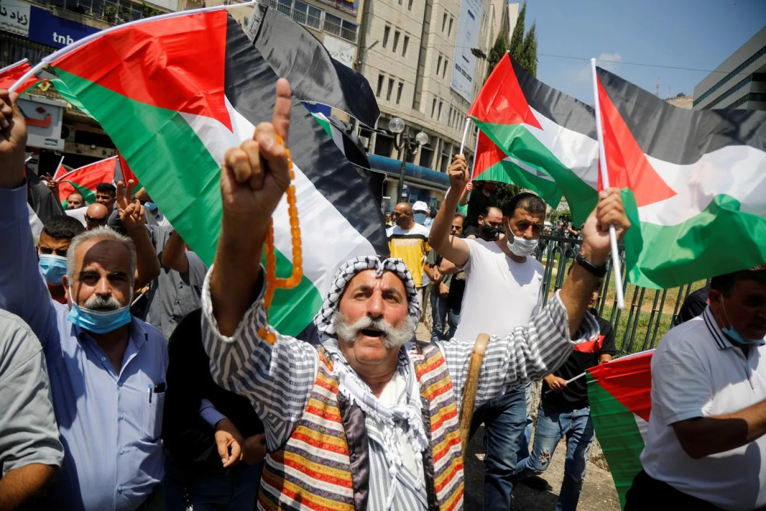 Palestinians take part in a protest against the United Arab Emirates' deal with Israel to normalise relations, in Nablus in the Israeli-occupied West Bank August 14, 2020. REUTERS/Raneen Sawafta
