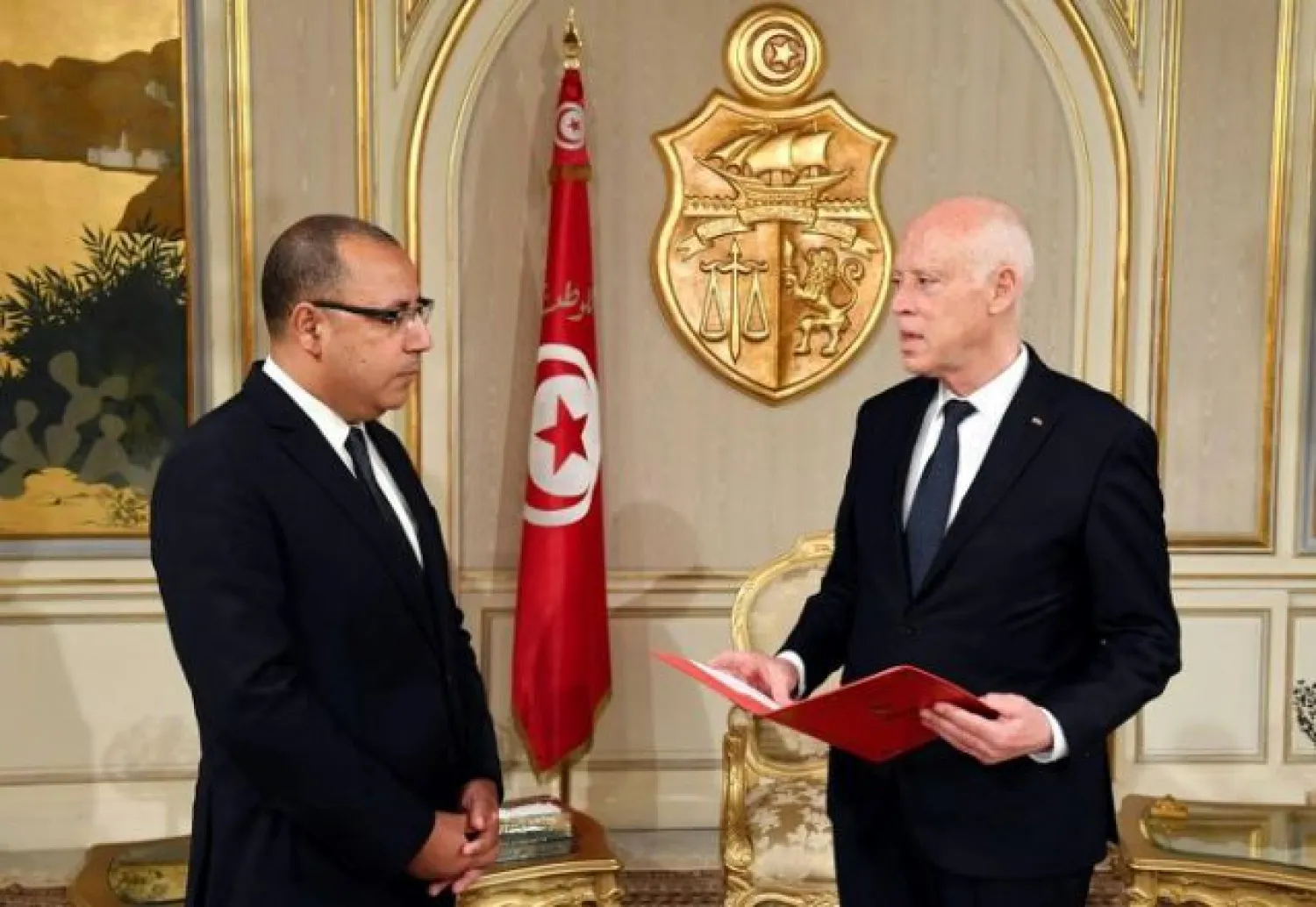 Tunisian President Kais Saied (R) and PM-designate Minister Hichem Mechichi at Carthage Palace. Reuters