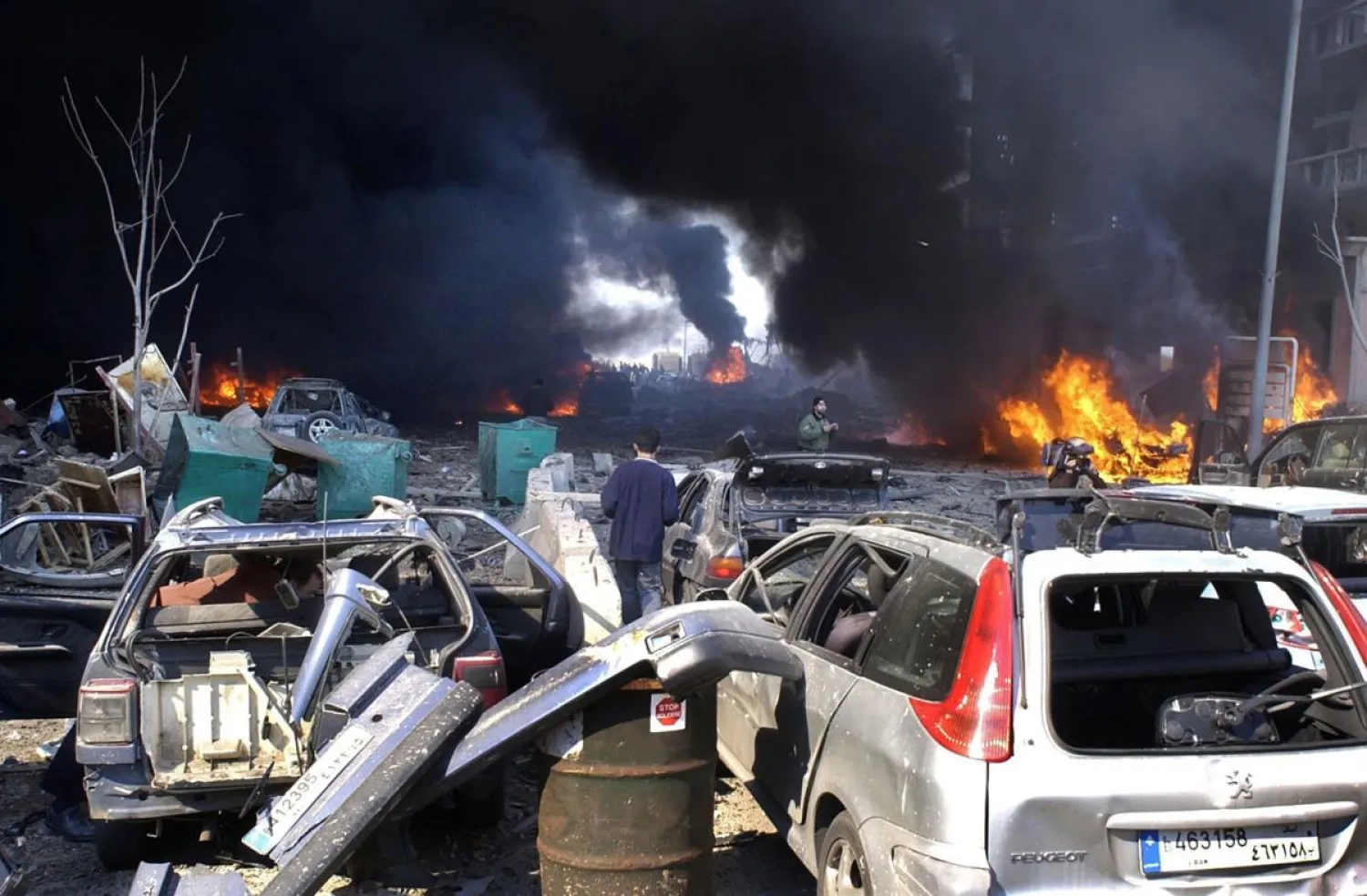 In this Feb. 14, 2005 file photo, destroyed vehicles litter the site of a massive bomb attack that tore through the motorcade of former Prime Minister Rafik Hariri in Beirut, Lebanon. More than 15 years after the truck bomb assassination of Hariri in Beirut, a UN-backed tribunal in the Netherlands is announcing verdicts this week in the trial of four members of the militant group Hezbollah allegedly involved in the killing. (AP Photo, File)