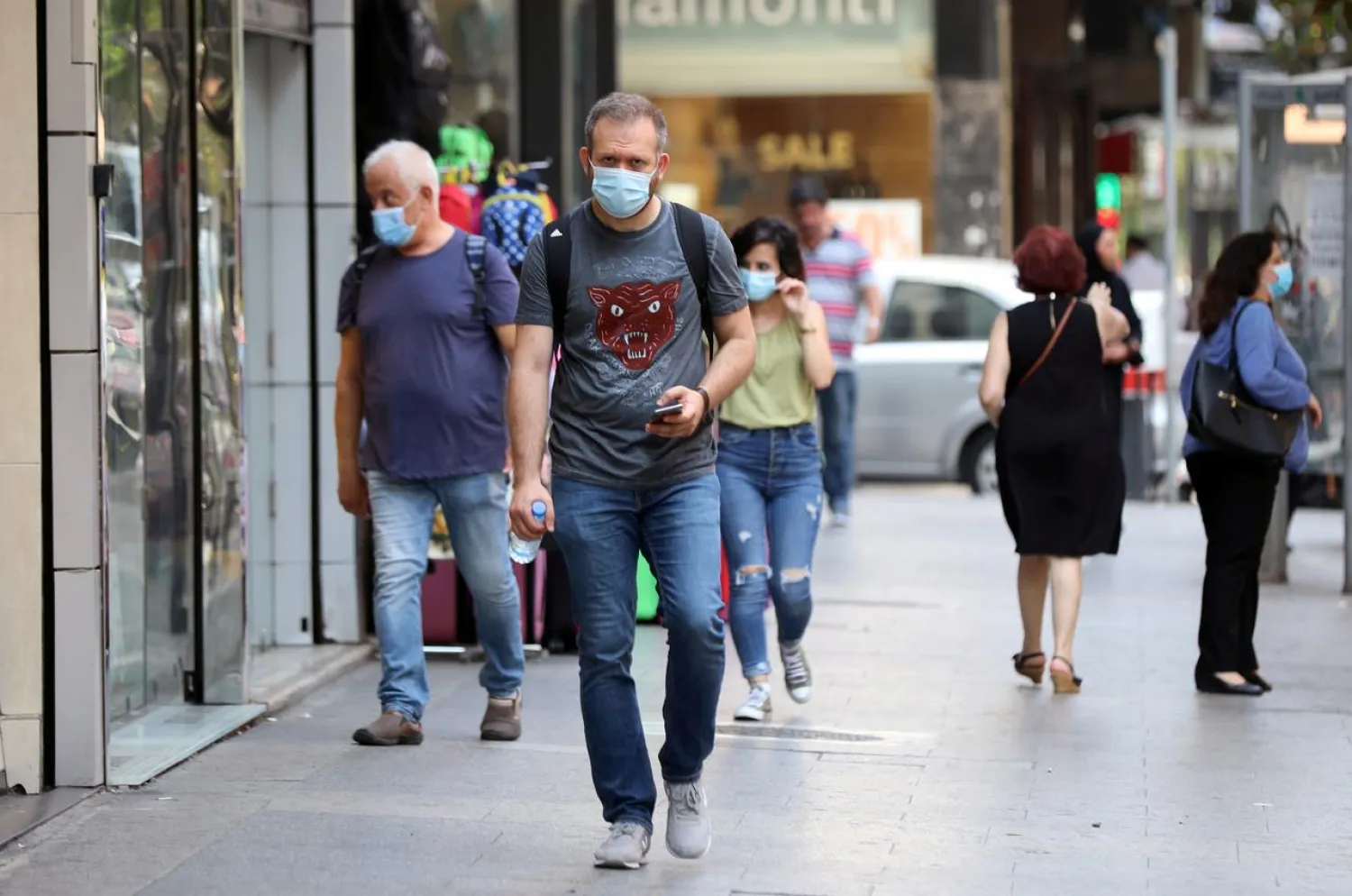 FILE PHOTO: People walk as they wear face masks to prevent the spread of the coronavirus disease (COVID-19) in Beirut, Lebanon July 28, 2020. REUTERS/Mohamed Azakir