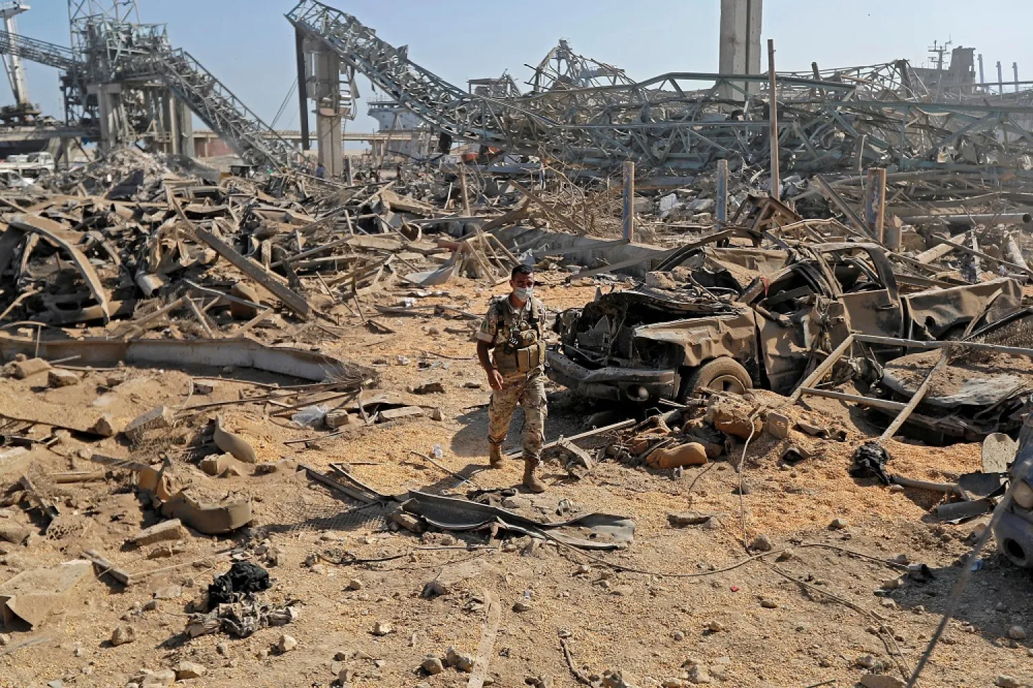 A Lebanese soldier walks amid the debris of the Port of Beirut on August 7, 2020, three days after a massive explosion rocked the Lebanese capital there. (AFP)