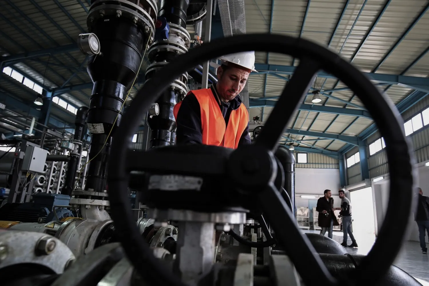 An employee at a water desalination plant on 19 January 2017 [SAID KHATIB/AFP/Getty Images]