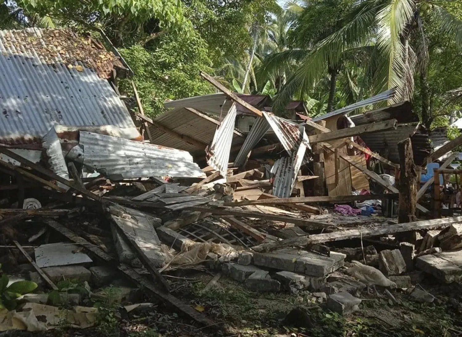 In this photo provided by the Philippine Red Cross, a toppled house is seen after a quake struck in Cataingan, Masbate province, central Philippines on Aug. 18, 2020. (AP)