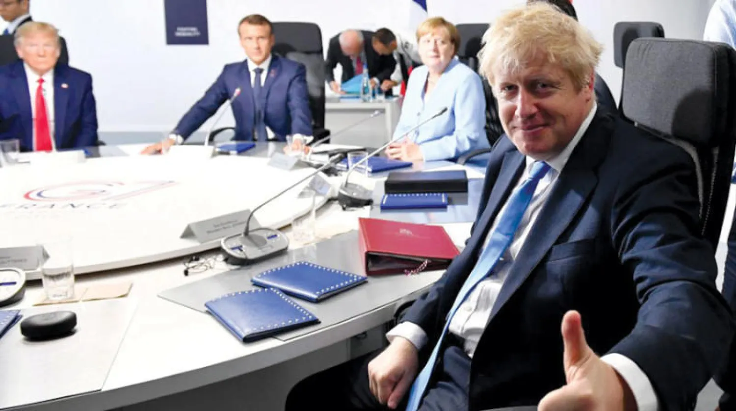 رئيس الوزراء البريطاني والمستشارة الألمانية والرئيسان الأميركي والفرنسي في قمة مجموعة السبع في بياريتس اغسطس 2019 (رويترز)