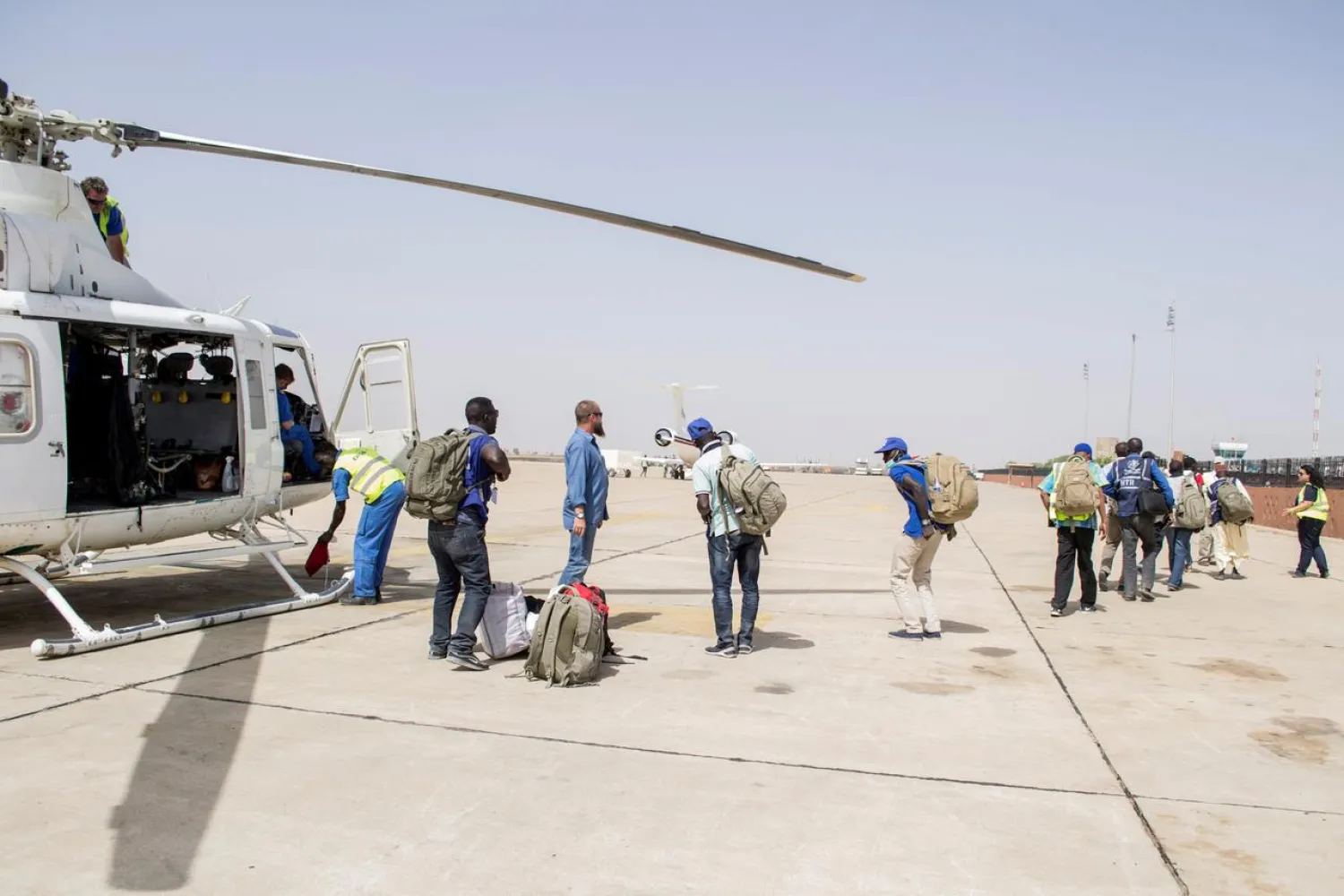 FILE PHOTO: UNHAS members assist with the relocation of aid workers after an attack in the town of Rann, at Maiduguri Airport, Nigeria March 2, 2018. OCHA/Yasmina Guerda/File Photo Handout via REUTERS 