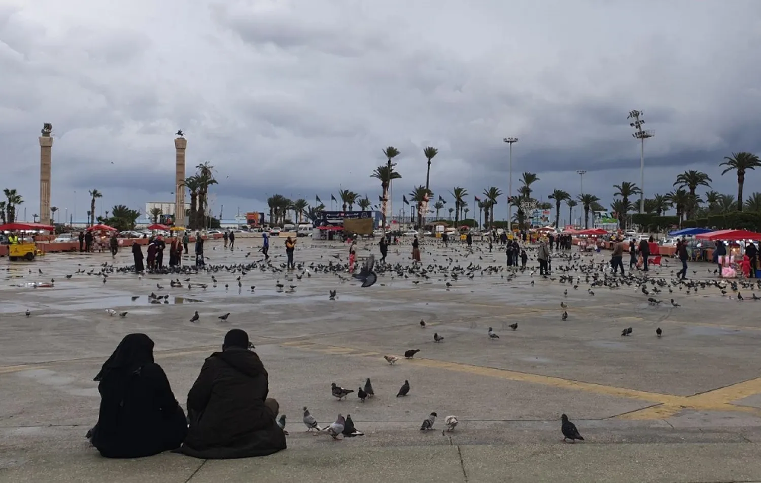 Libyans sit at Martyrs' Square in the capital Tripoli. (AFP)