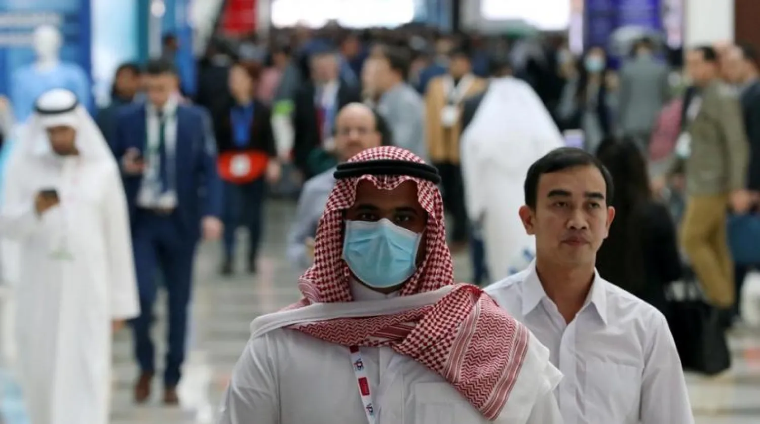 A visitor wears a mask during the Arab Health Exhibition in Dubai on January 29, 2020 | REUTERS