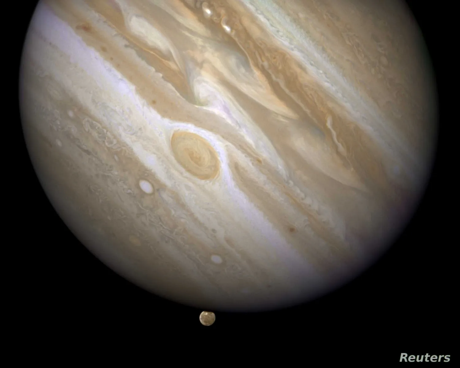 Jupiter is shown with one of its moons, Ganymede (bottom), in this NASA handout taken April 9, 2007 | Reuters
