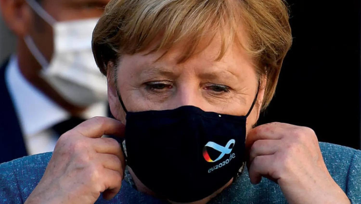 ميركل طالبت في بيان شديد اللهجة بتحديد المسؤولين وتقديمهم إلى المحاسبة (أ.ب)