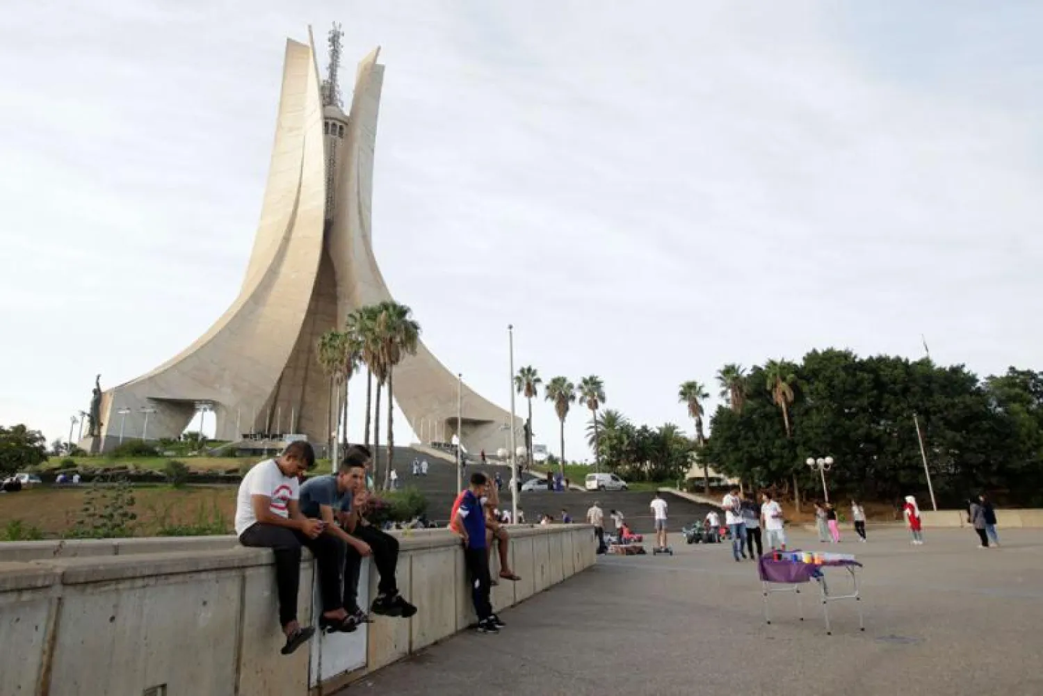 Algerian youths sit near the Martyrs' Memorial in Algiers. Reuters file photo