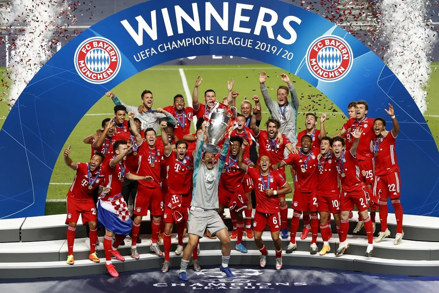 Bayern Munich's Manuel Neuer lifts the trophy with his teammates after winning the Champions League final match against PSG in Lisbon, Portugal, Aug. 23, 2020. (AP)