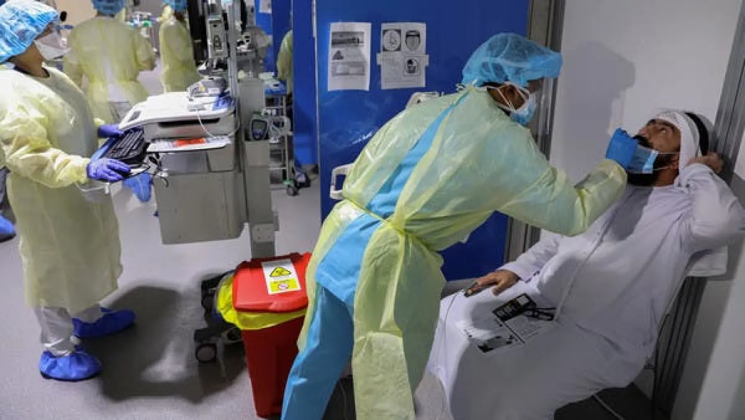 A medical worker swabs a man during testing amid the coronavirus outbreak, at the Cleveland Clinic hospital in Abu Dhabi on April 20, 2020. (Reuters)