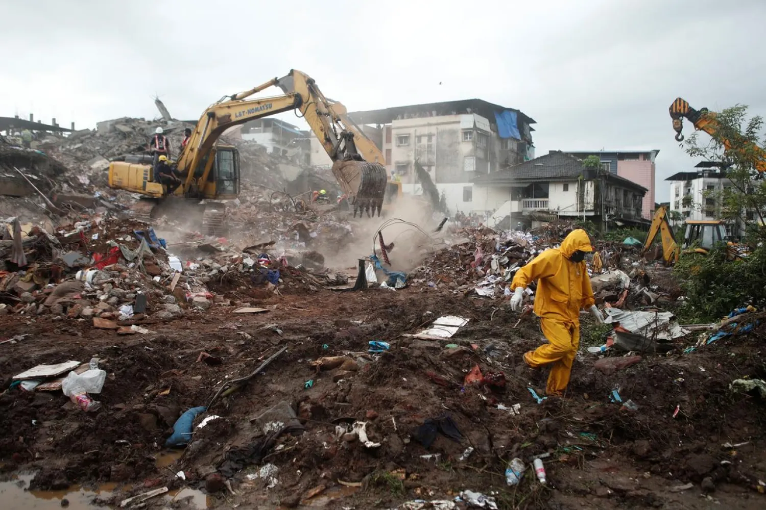 Rescue workers search for survivors in the debris after a five-story building collapsed in Mahad in Raigad district in the western state of Maharashtra, India, August 25, 2020. (Reuters)
