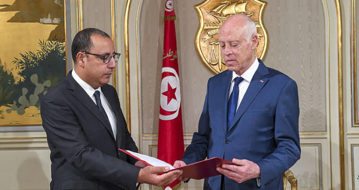 رئيس الوزراء المكلف يقدم تشكيلة حكومته المقترحة للرئيس التونسي (أ.ف.ب)