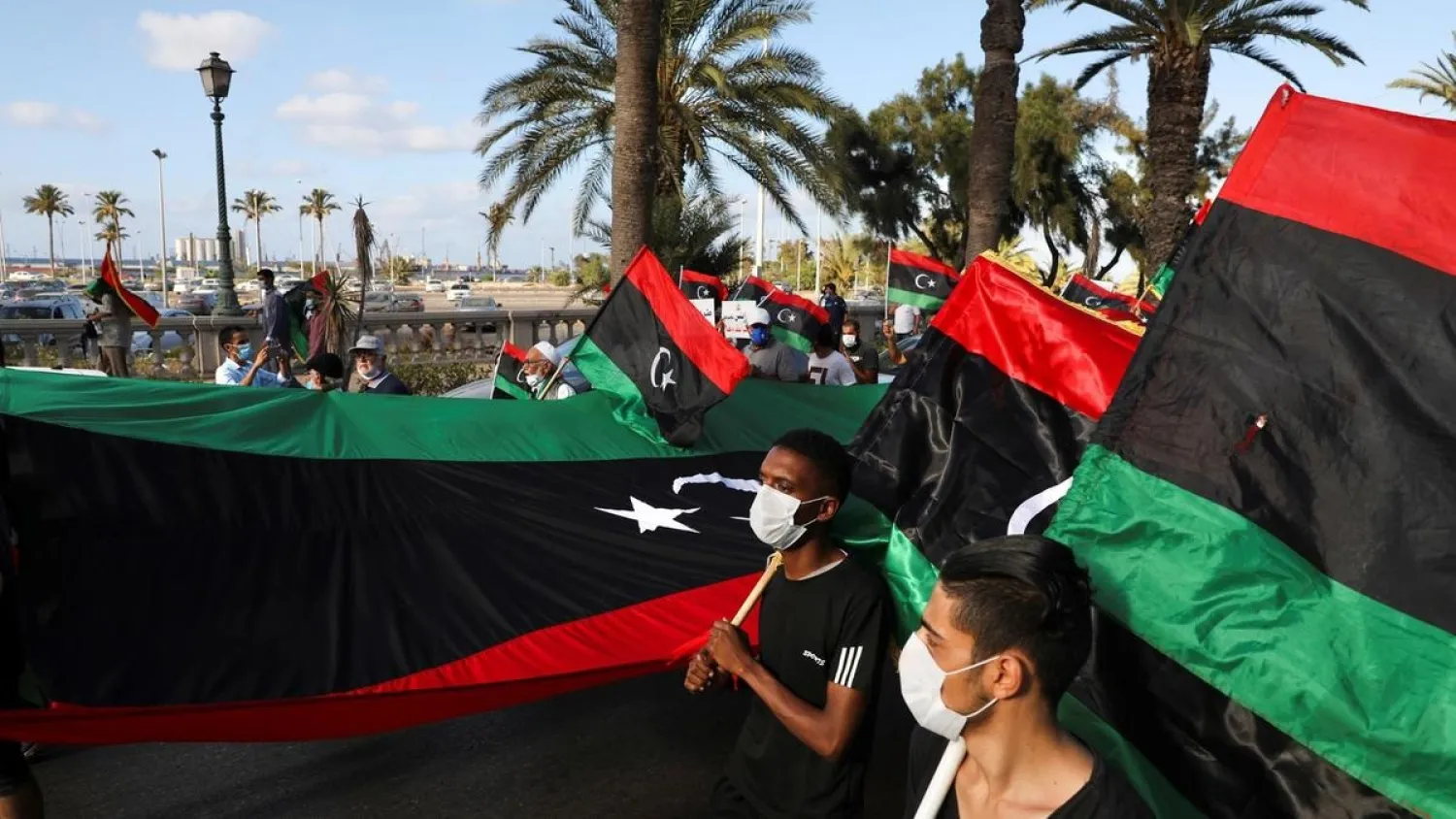 Demonstrators march during an anti-government protest in Tripoli, Libya, August 25, 2020, (Reuters)