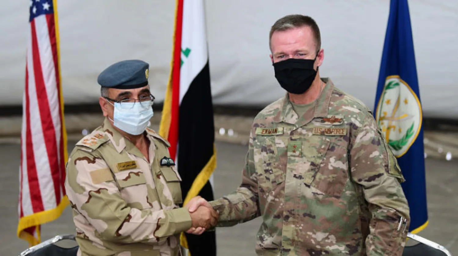 مراسم تسليم القوات الأميركية قاعدة التاجي شمال بغداد إلى الجيش العراقي الأحد الماضي (إ.ب.أ)