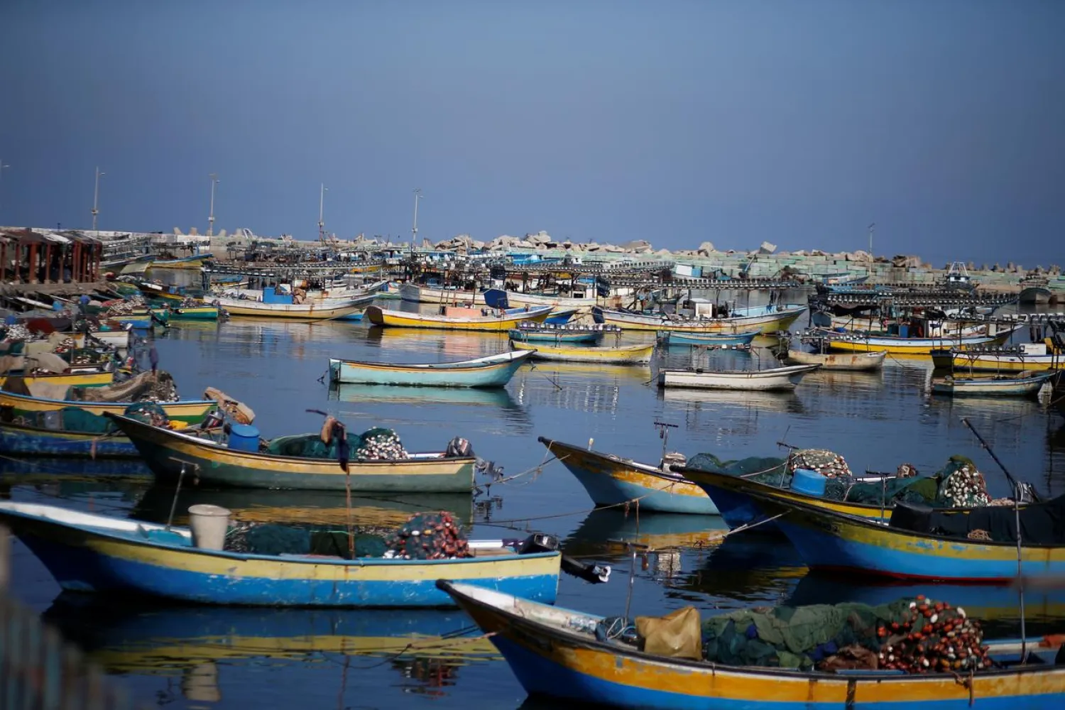 A view shows tied up fishing boats during a lockdown following the recent outbreak of the coronavirus disease (COVID-19) in the general population, at the seaport of Gaza City August 28, 2020. REUTERS/Mohammed Salem
