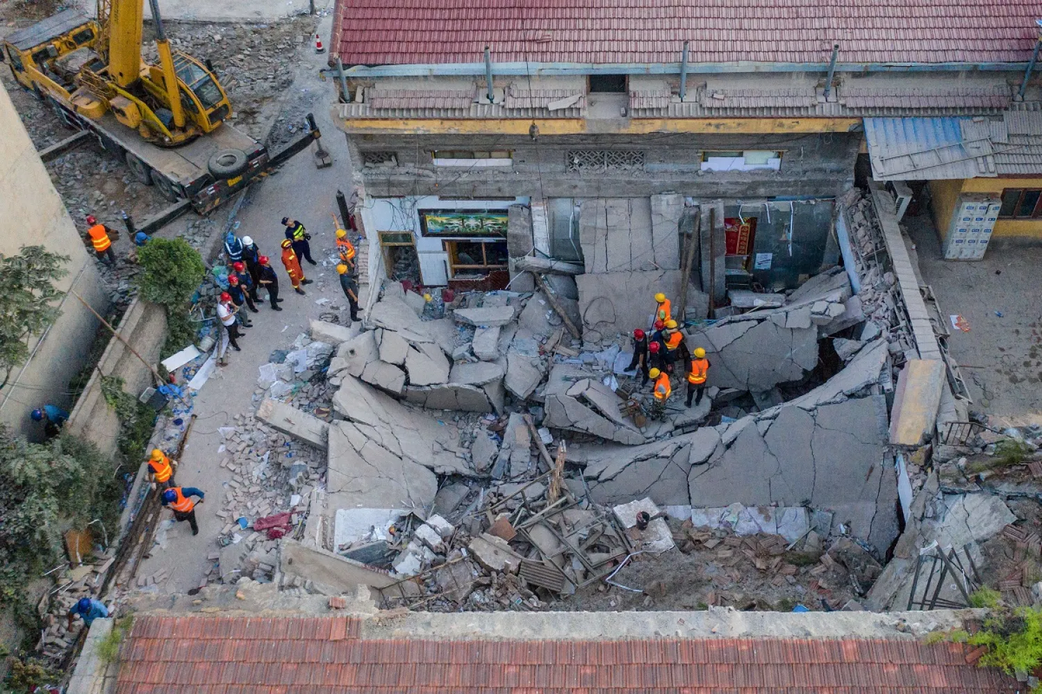 This aerial view taken on August 29, 2020, shows rescuers searching through the rubble of a collapsed restaurant in Linfen, in China's northern Shanxi province. (AFP)