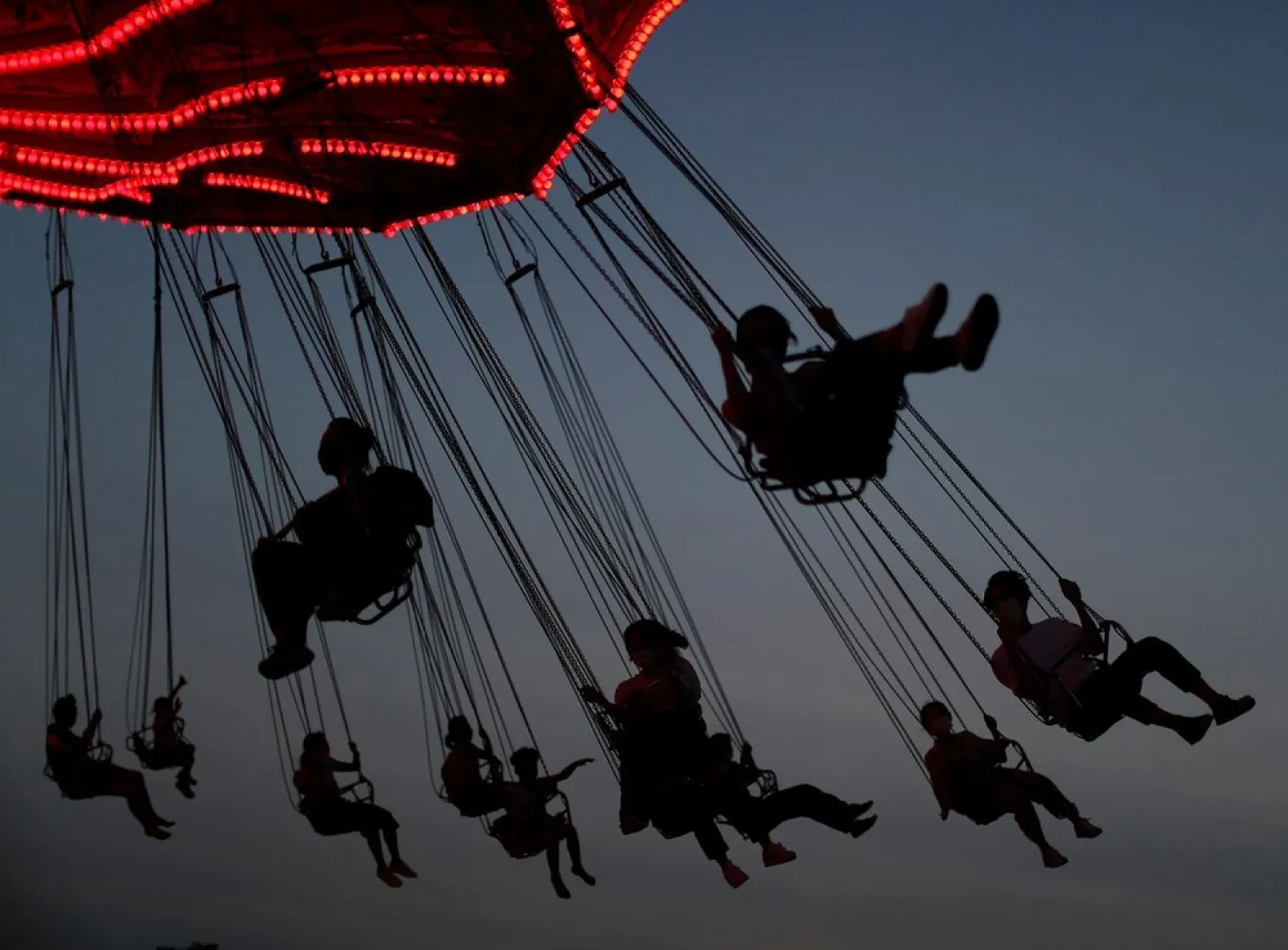 Visitors enjoy an attraction at Toshimaen amusement park, in Tokyo, Japan August 9, 2020. (Reuters)