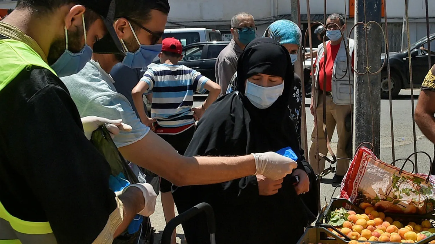 Volunteers hand out masks in the Algerian capital, Algiers. (Getty Images)