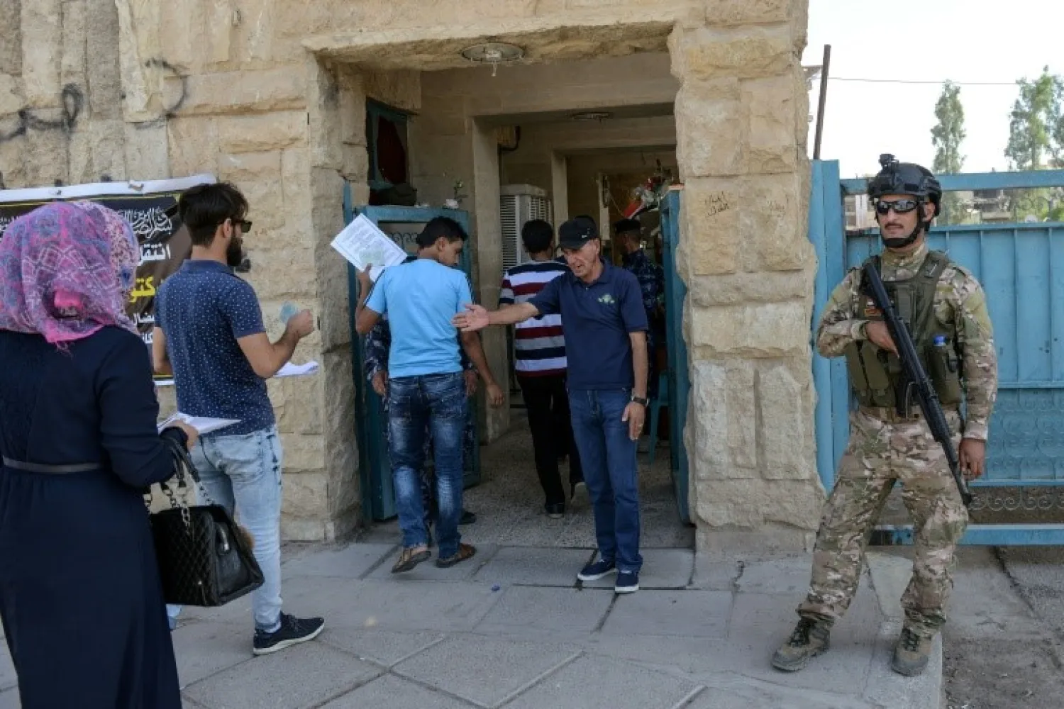 Iraqi students are searched as they arrive to take their exams (File photo: AFP)