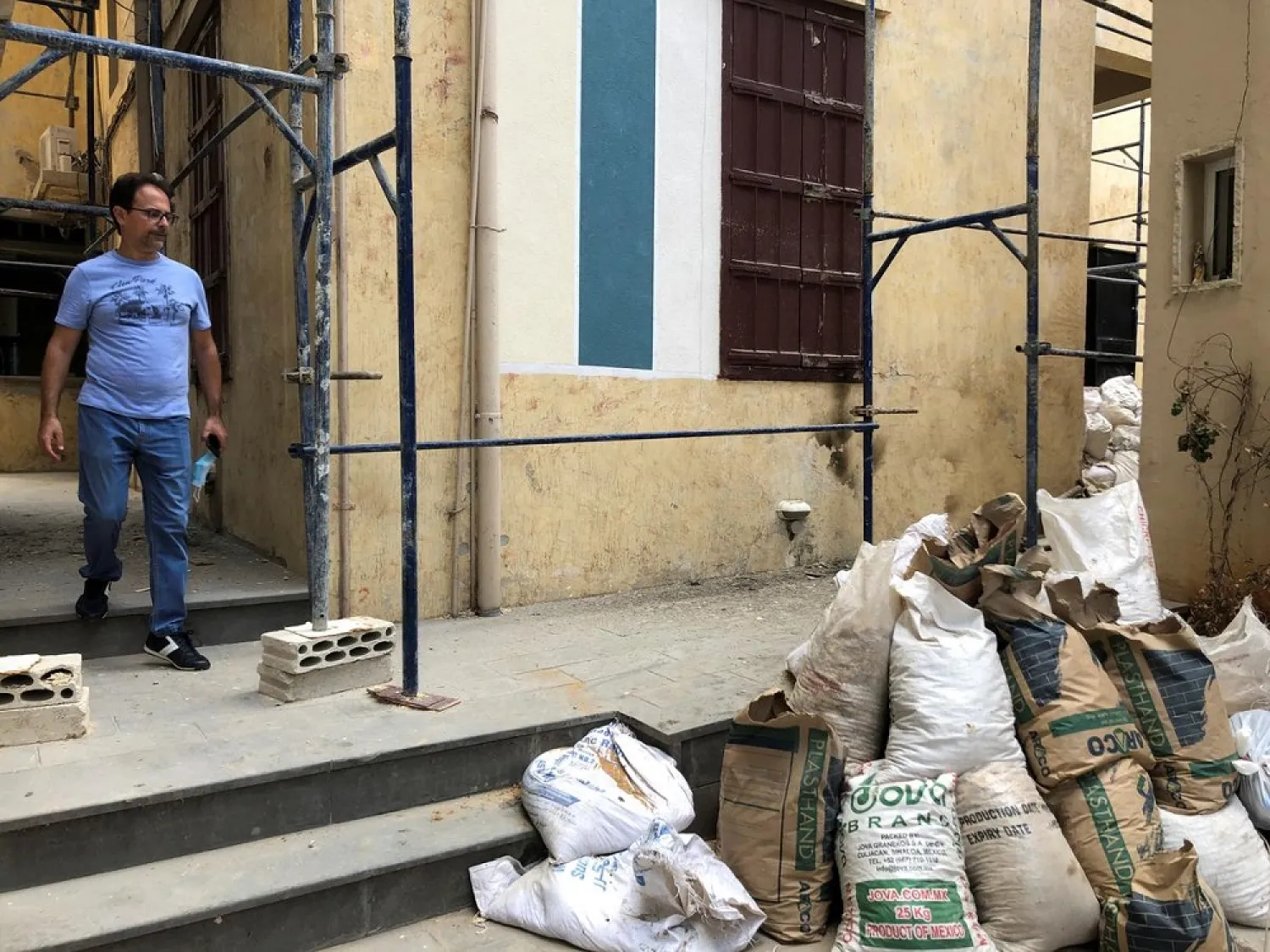 Joe Nader, a bank employee and property owner, walks at his building which was damaged due to the massive explosion at Beirut's port area, in Beirut, Lebanon August 26, 2020. (Reuters)