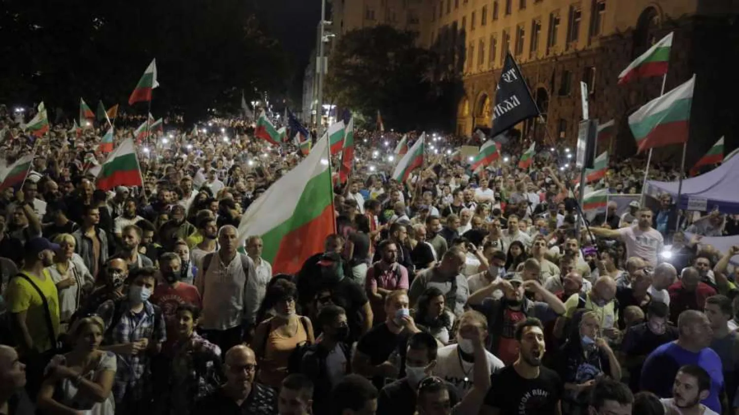 Protesters gathered for a mass protest in front of the new National Assembly building, demanding government resignation in Sofia, Bulgaria, Wednesday, Sept. 2, 2020. (AP Photo/Valentina Petrova)