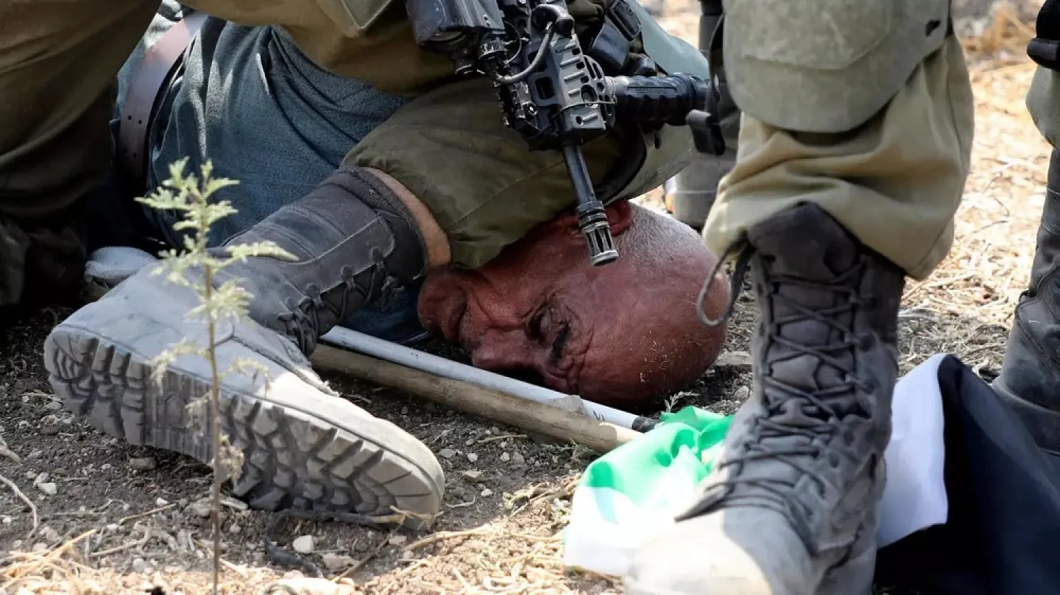Israeli soldiers detain a Palestinian protester on September 1, 2020. (AFP)