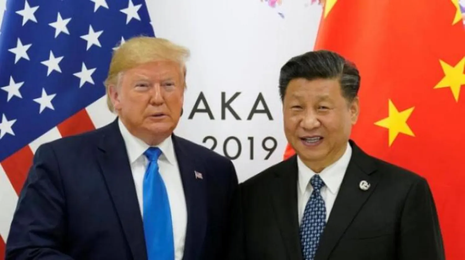 Çin Devlet Başkanı Şi Cinping ve ABD Başkanı Donald Trump, Japonya’nın Osaka kentindeki G20 zirvesinde oturum aralarında bir araya geldi (Reuters-Arşiv)