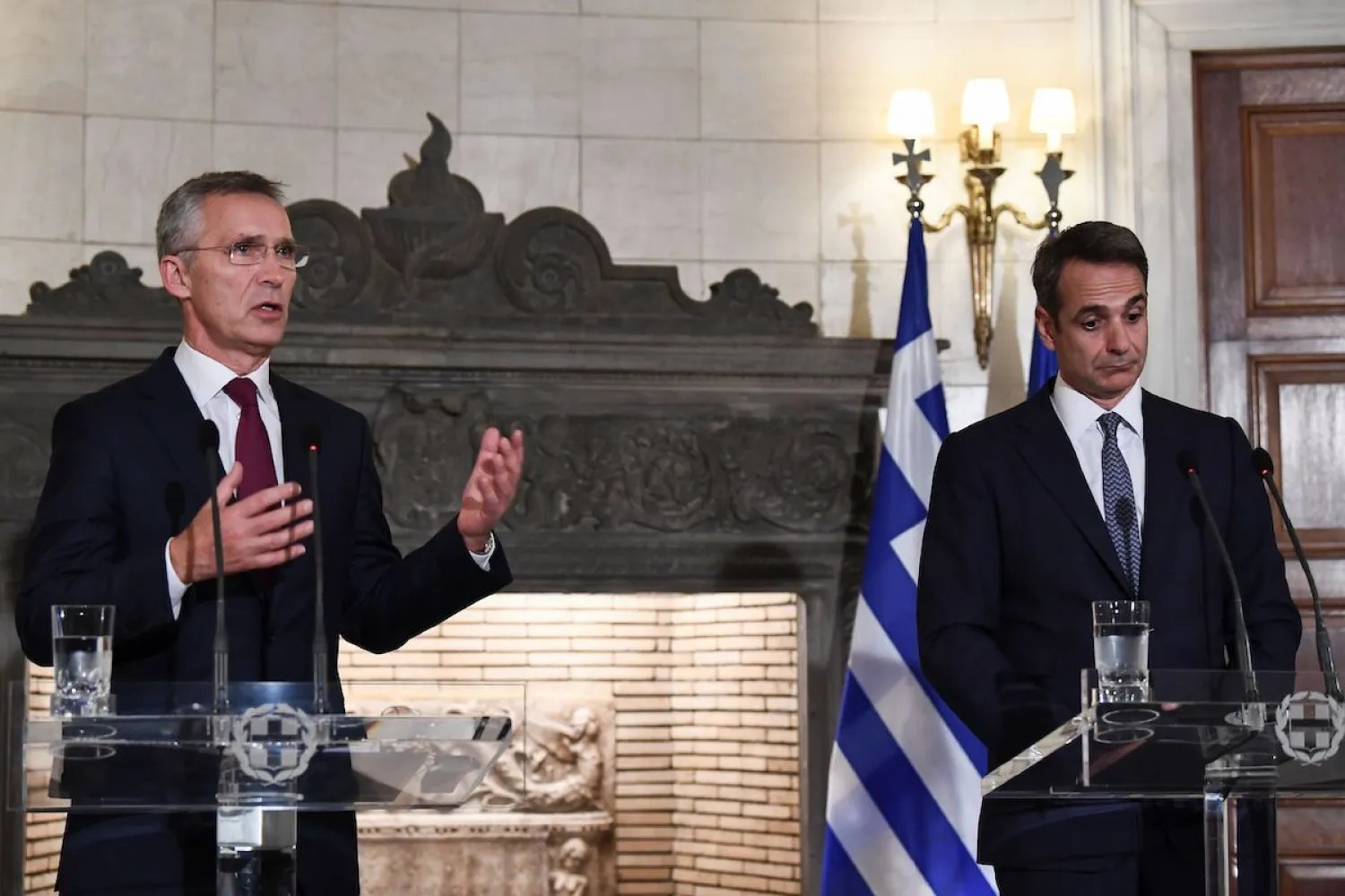 NATO Secretary-General Jens Stoltenberg (L) speaks next to Greek Prime Minister Kyriakos Mitsotakis during a press conference after their meeting in Athens on 10 October 2019. [ARIS MESSINIS/AFP via Getty Images] 