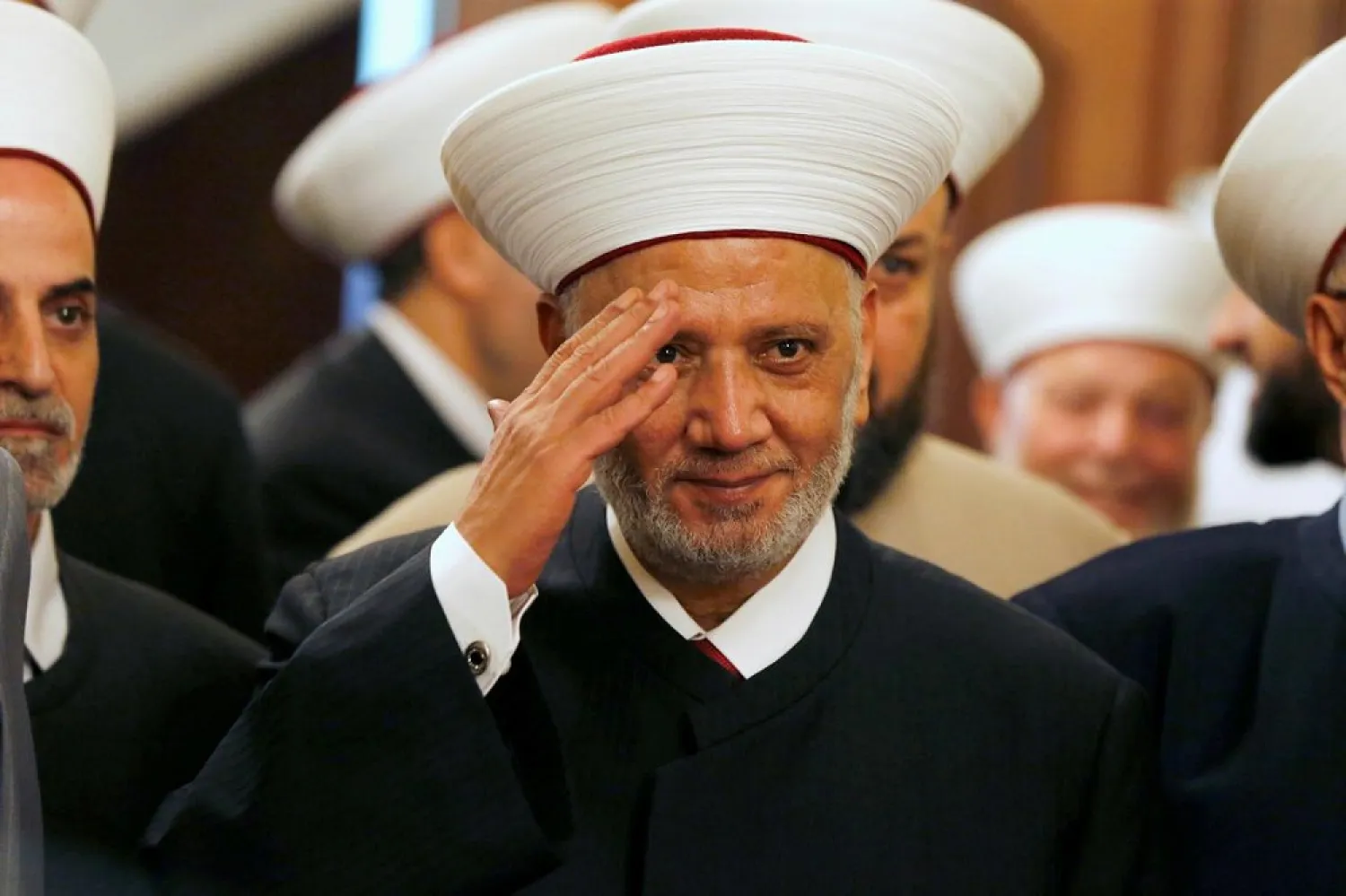 Lebanese Grand Mufti Sheikh Abdul Latif Derian gestures during a ceremony for his appointment in Beirut August 10, 2014. (Reuters)