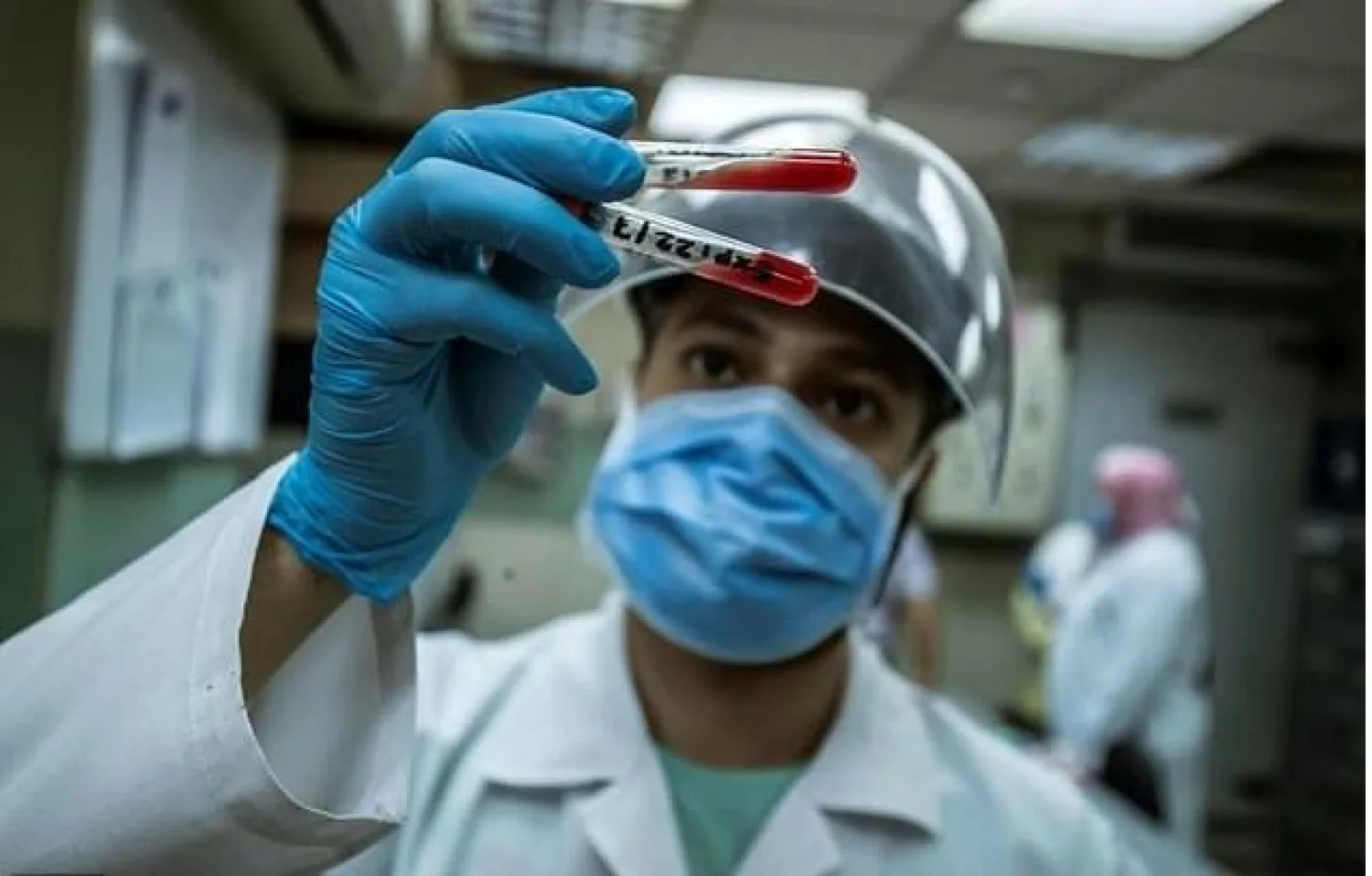 An Egyptian medical worker checks blood donated from a person who recovered from Covid-19 inless at the National Blood Transfusion centre in Cairo

