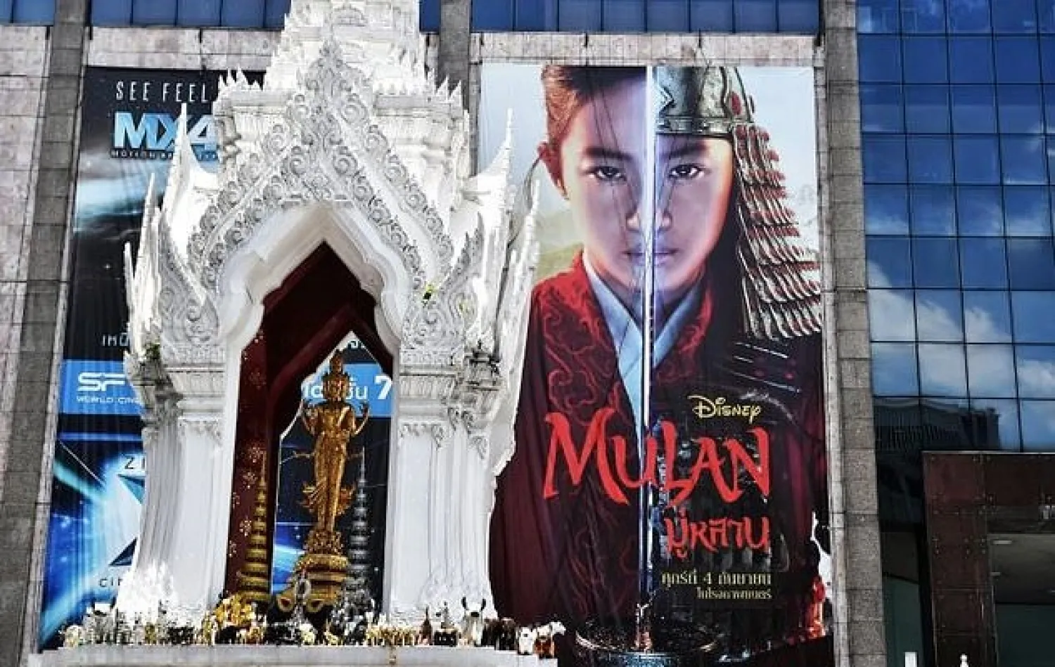 A billboard for Disney's "Mulan" film is seen outside a shopping mall in Bangkok, where calls for a boycott of the movie are growing - AFP

