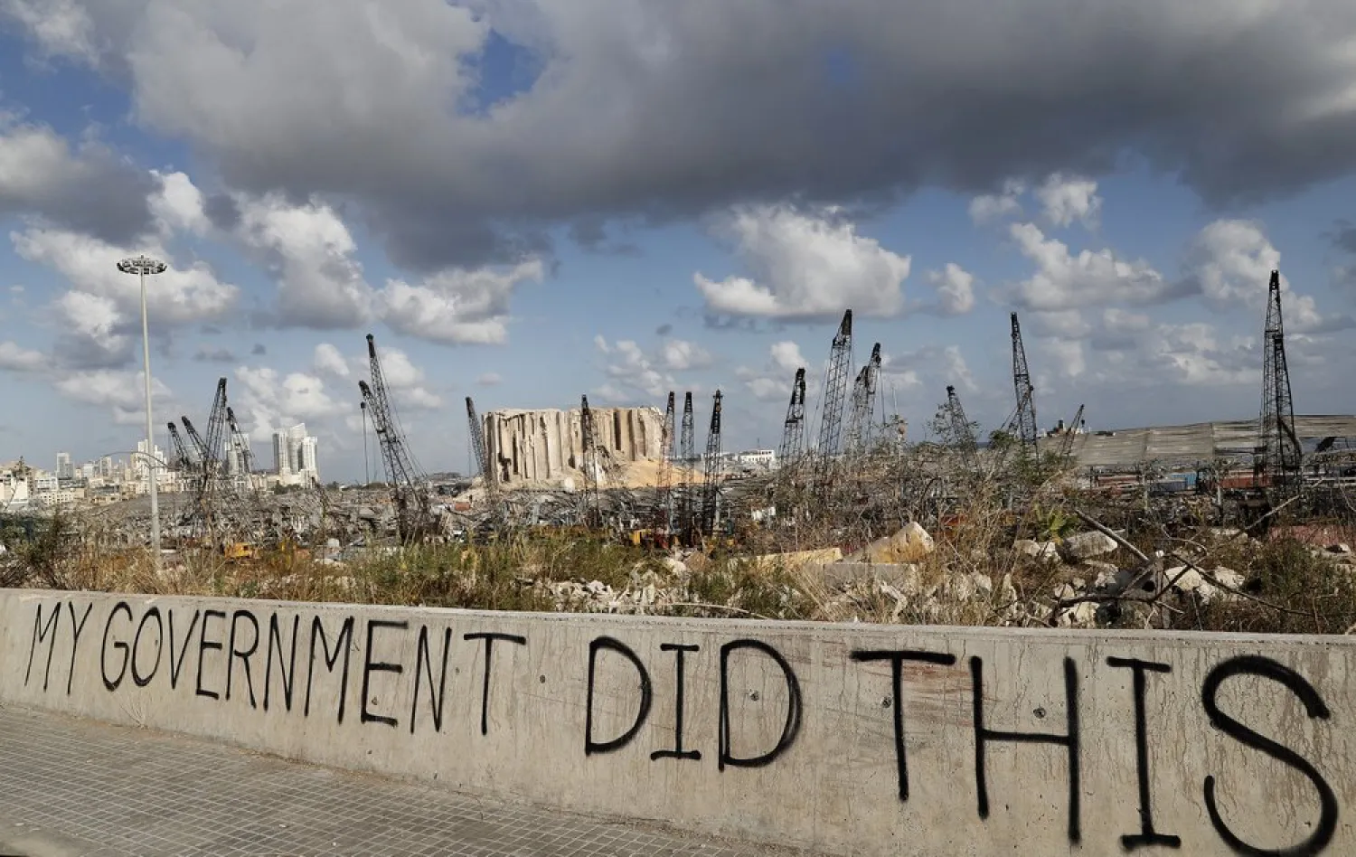 Words are written by Lebanese citizens in front of the scene of the explosion that hit the seaport of Beirut, Lebanon, Sunday, Aug. 9, 2020. (AP)