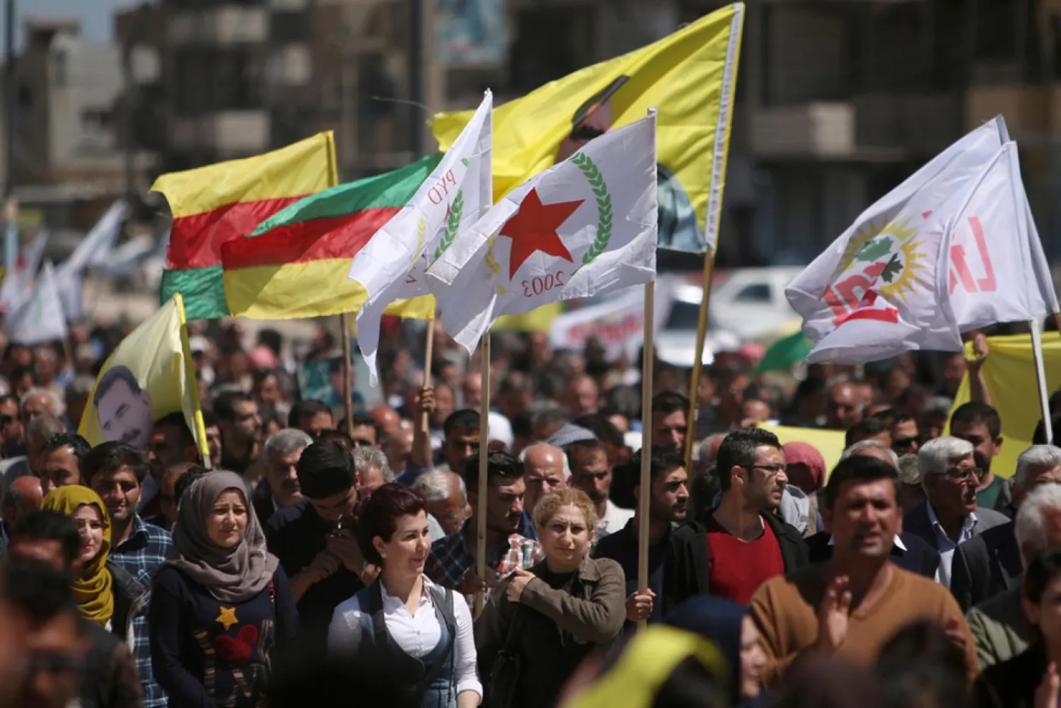 Syrian Kurds march in Qamishli in protest at Turkish attacks on SDF forces (Reuters)