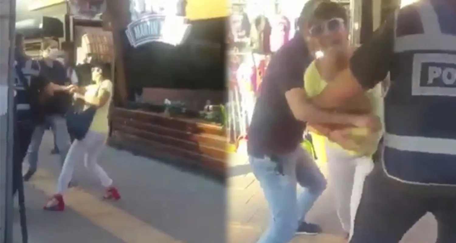 Maske takmamak için polise direnen kadına hemcinsinden görülmemiş tepki...