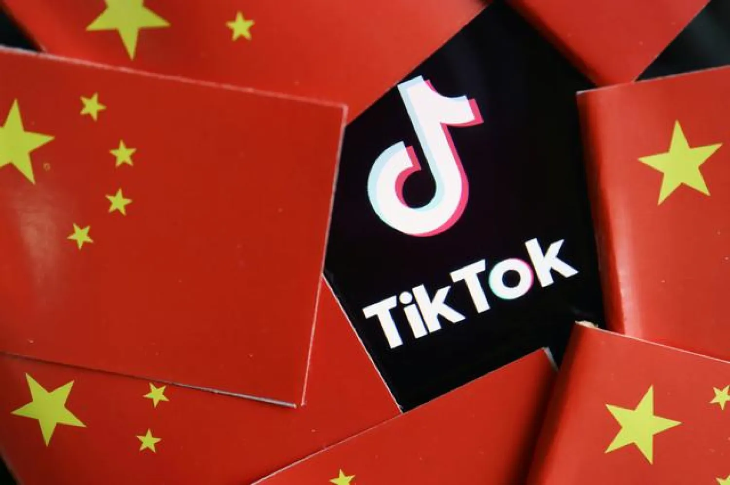 FILE PHOTO: China's flags are seen near a TikTok logo in this illustration picture taken July 16, 2020. REUTERS/Florence Lo/Illustration/File Photo
