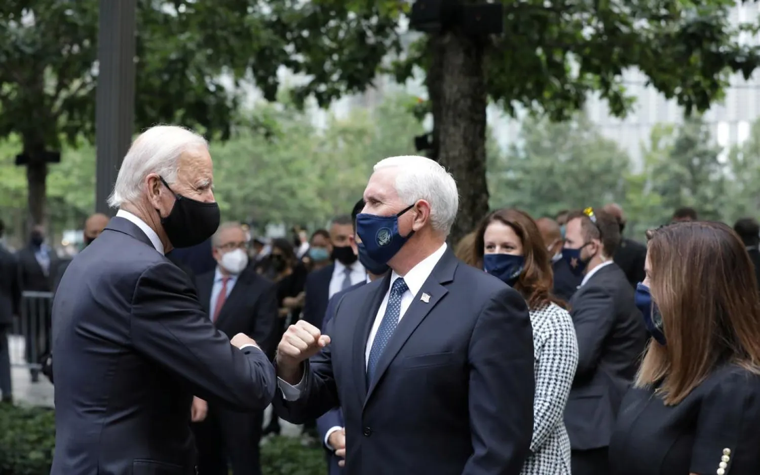 Democratic presidential candidate Joe Biden and Vice President Mike Pence greet each other during the 19th anniversary of the 9/11 attacks in New York City, New York, US, September 11, 2020. (Reuters)