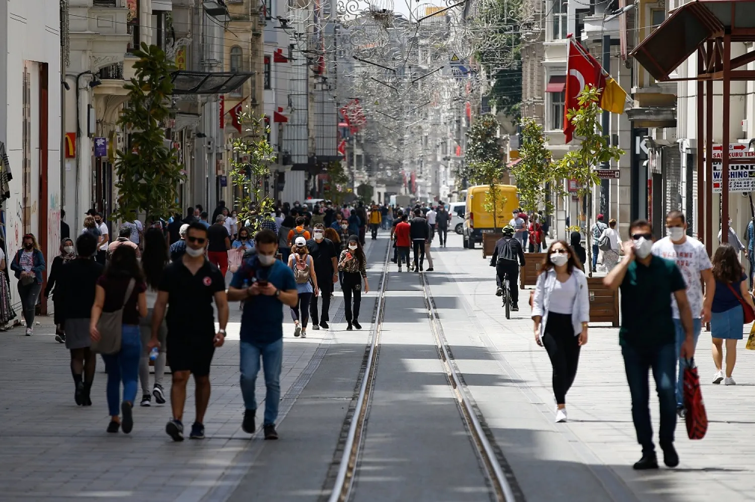 People walk on Istiklal Avenue, one of the main shopping streets in Istanbul, Turkey, during the coronavirus outbreak, May 15, 2020. (AP)